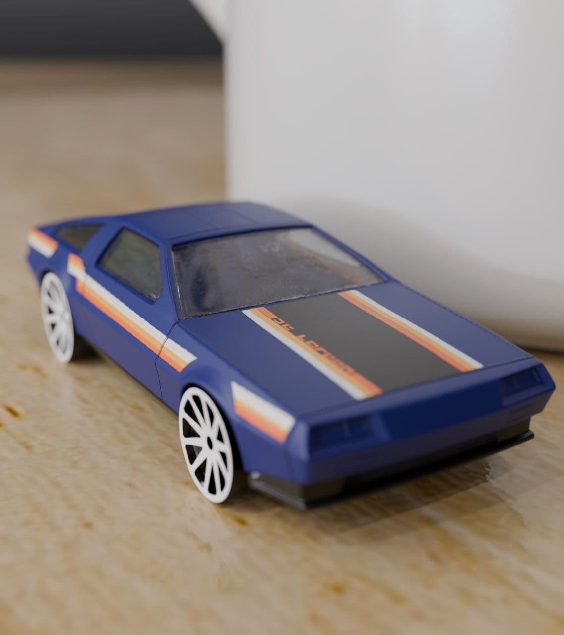 A blue toy sports car with orange and white racing stripes on the hood.